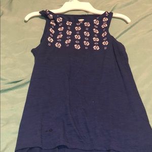 Blue tank top with white designs